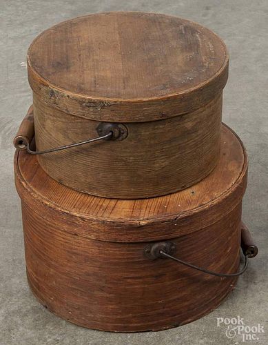 Two pine lidded pantry boxes, 19th c., with bail handles, 6 1/2'' h., 11'' dia. and 5 1/2'' h.