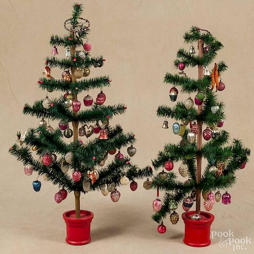 Two contemporary Christmas feather trees, filled with vintage glass ornaments, 35'' h.