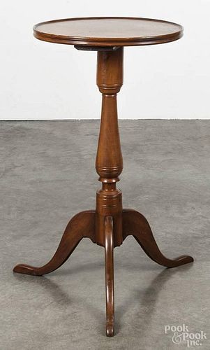 Pennsylvania cherry candlestand, 19th c., with a dish top, a vasiform standard, and cabriole legs