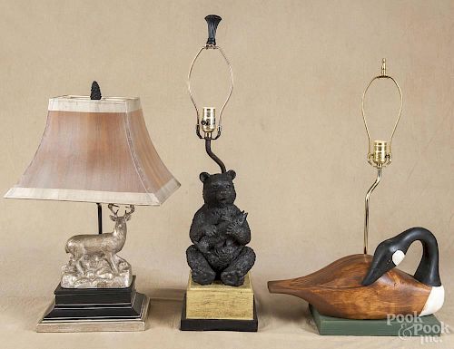 Three contemporary table lamps with a bear, a deer and a carved and painted goose