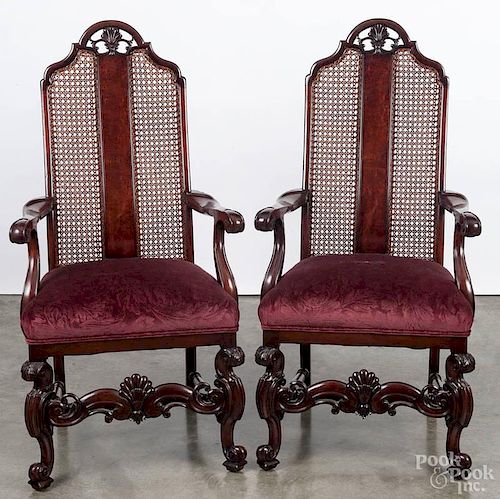 Pair of French style mahogany armchairs, 20th c., with cane backs.