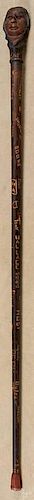 Carved fraternal walking stick, dated 1955, with a Native American Indian, 37 1/2'' h.