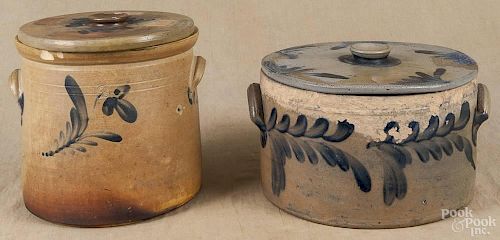 Two stoneware lidded cake crocks, 19th c., with cobalt floral decoration, 10'' h. and 7 1/2'' h.