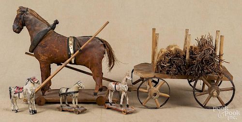 Wood horse and wagon pull toy, ca. 1900, 24'' h., together with two small horse pull toys
