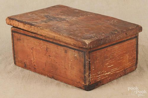 Painted pine box, 19th c., retaining an old red surface with pin stripes, 5 1/2'' h., 12 3/4'' w.