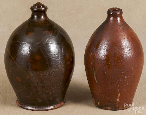 Two redware jugs, 19th c., 9'' h. and 8 3/4'' h.