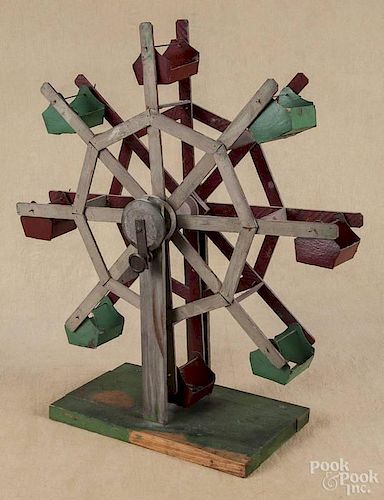 Primitive painted wood and cardboard Ferris wheel, early 20th c., 20'' h.