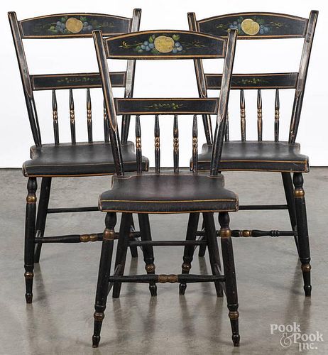 Three Pennsylvania painted half spindle plank bottom chairs, 19th c., overall - 33'' h.