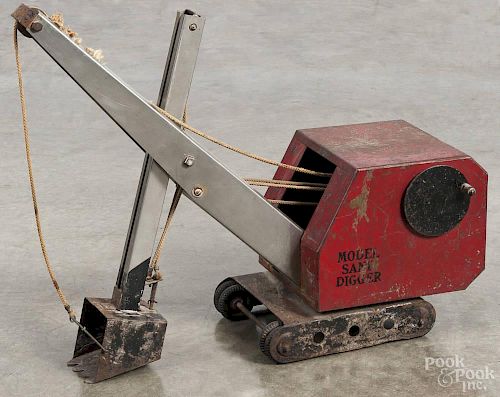 Model pressed steel sand digger, early 20th c., 19'' h.