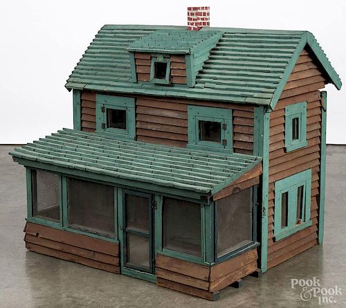 Large painted doll house, ca. 1900, with a screened in porch, 31'' h., 33'' w.