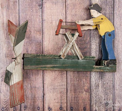Painted man sawing whirligig, early 20th c., 11'' h., 16'' w.