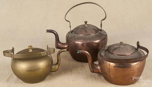 Two American copper tea kettles, ca. 1800, 7 3/4'' h. and 6 3/4'' h., together with a brass tea kettle
