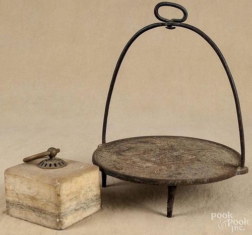 Cast iron hanging griddle, 19th c., 14 1/2'' dia., together with a marble door stop, 4 1/2'' h.