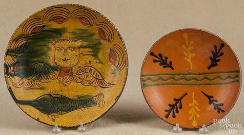 Greg Shooner, two redware plates, signed and dated 1998 and 2002, 8 1/2'' dia. and 11'' dia.