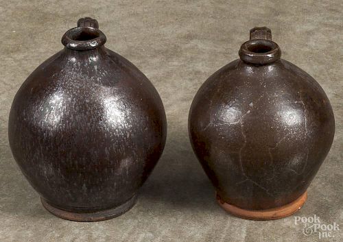 Two redware ovoid jugs, 19th c., 6 1/2'' h. and 7'' h.