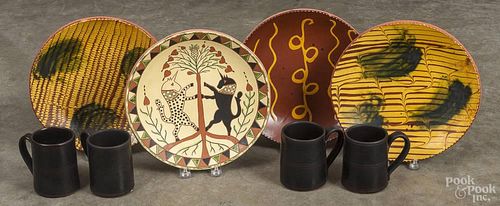 Lester Breininger, four redware plates, signed and dated 1981 and 2009, 10 1/2" dia.