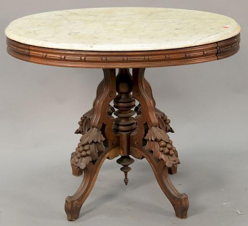 Large oval Victorian marble top table, ht. 28 1/2", top: 27" x 35".