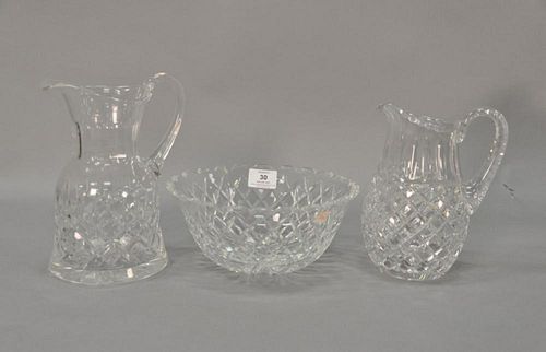 Three Waterford pieces including two pitchers and a center bowl. pitchers: ht. 8" & 9"; dia. 9"