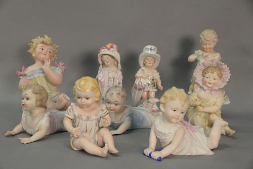 Group of nine porcelain and bisque baby and child figures. ht. 5 1/2" to 12 1/2"