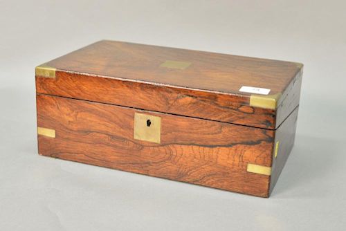 Small rosewood Victorian lap desk with brass bound corners and leather writing surface. ht. 5 1/2", lg. 14".