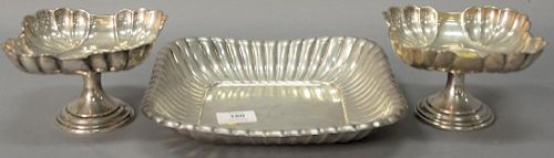 Three sterling silver pieces to include a pair of compotes (ht. 3 1/2"), and a Reed & Barton square scallop edge dish (9 1/2" x 9 1/...