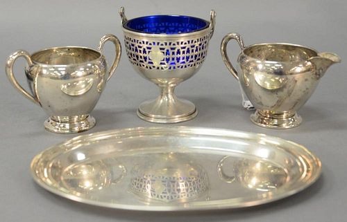 Four sterling silver pieces including creamer, sugar, small tray, and a small basket with cobalt liner. 12.3 t oz.