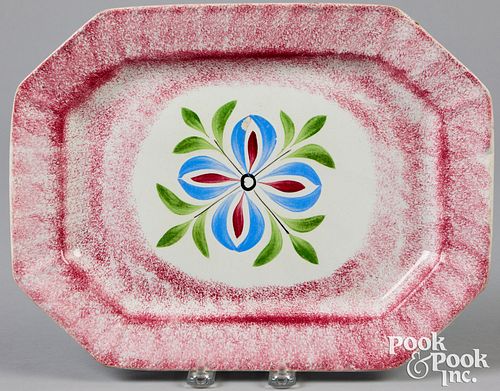 Red spatter platter with four petal flower