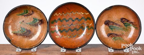 Three Southeastern Pennsylvania redware plates