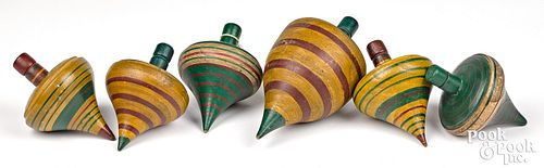 Six boldly painted wooden tops, 19th c.