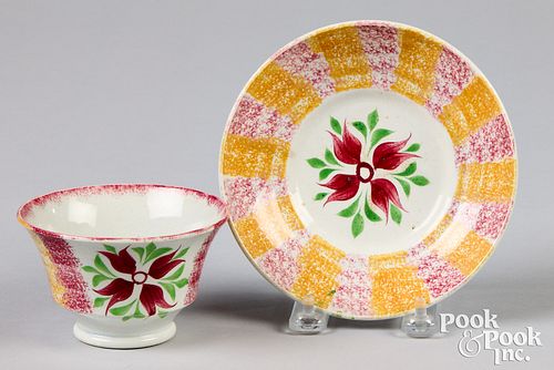 Yellow and red spatterware cup and saucer