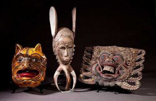 Group of Three Carved Wooden Masks, 20th c., one A