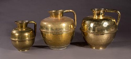 Group of Three French Brass Milk Pitchers, 19th c.