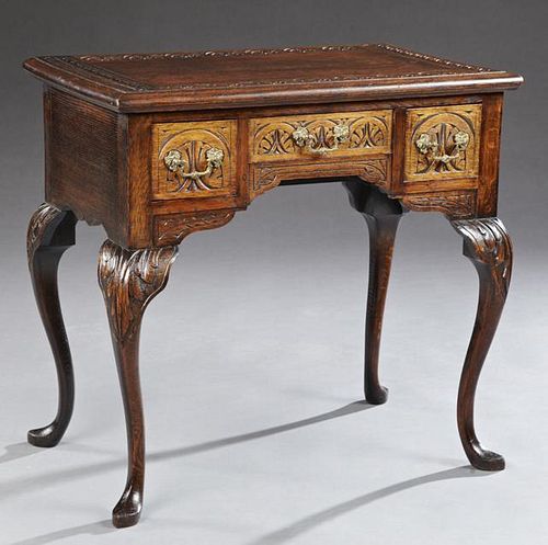 Carved Oak Queen Anne Style Lowboy, 20th c., with