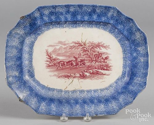 Blue spatter platter with red transfer decoration of a Peruvian Horse hunt, 10 3/4'' l., 23 3/4'' w.