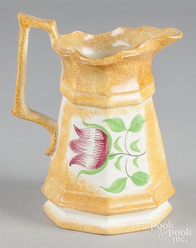 Yellow spatter pitcher with tulip decoration, 8 1/2'' h.