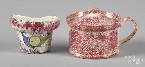 Red spatter mustard pot, 2 3/4'' h., together with a small pocket with peafowl decoration, 2 1/8'' h.