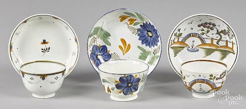Three English pearlware cups and saucers, 19th c.