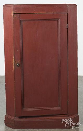 Painted pine corner cupboard base, 19th c., retaining an old red surface, 53'' h., 31'' w.