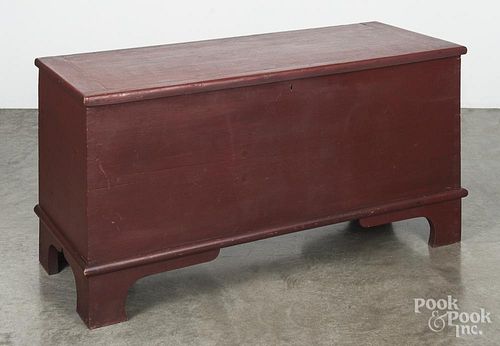 Painted pine blanket chest, 19th c., retaining an old red surface, 25'' h., 48'' w.