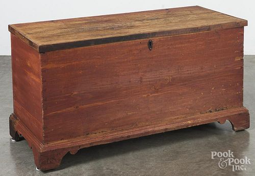 Painted pine blanket chest, early 19th c., retaining an old red surface, 25'' h., 45 3/4'' w.
