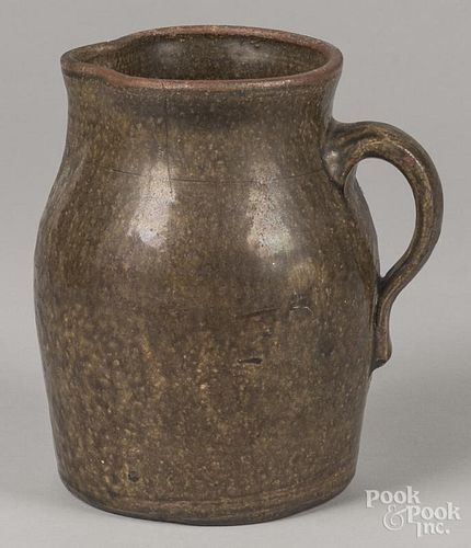 Southern alkaline glaze stoneware pitcher, 19th c., 9'' h.