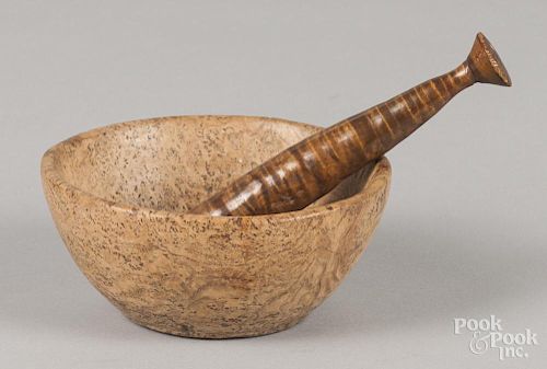 Small New England burl bowl, together with a maple pestle, 2 1/4'' h., 5 1/2'' w.