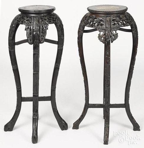Two Chinese carved hardwood stands, early 20th c., with marble inset tops, 35 1/4'' h.