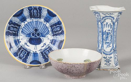 Delft items, 18th c., to include a plate, 8 7/8'' dia., a bowl, 2 3/4'' h., 7 1/2'' dia., and a vase