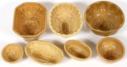 YELLOW WARE POTTERY CAKE MOLDS 7 PIECES