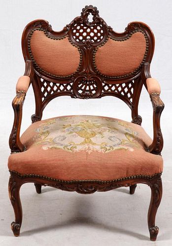 CARVED WALNUT AND NEEDLEPOINT ARM CHAIR