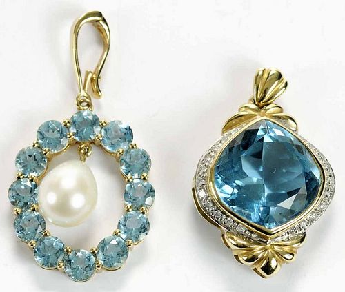 Two 14 kt and Blue Topaz Pendants