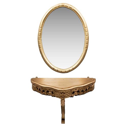 COQUETA SIGLO XX Elaborada en madera policromada en tono dorado Consola empotrable Espejo con luna oval biselada, marco con...