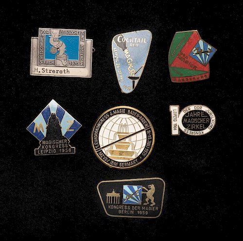 [Badges and Pins] Collection of Seven Vintage Magic Convention Pins. German, 1950s Ð 70s. Including five color enameled brass examples from various 1