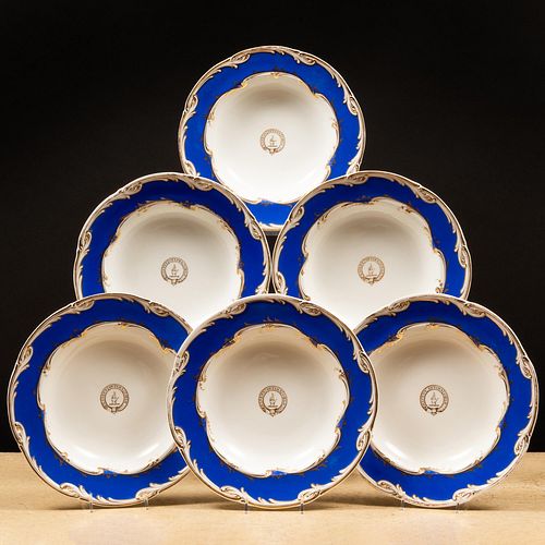 Set of Eight English Blue Ground Porcelain Crested Soup Plates